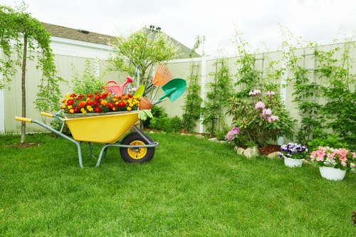 Gardener speaking with a client at the entrance of a Stoke Newington property